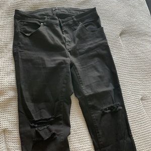 High waist black denim jeans - distressed at knee